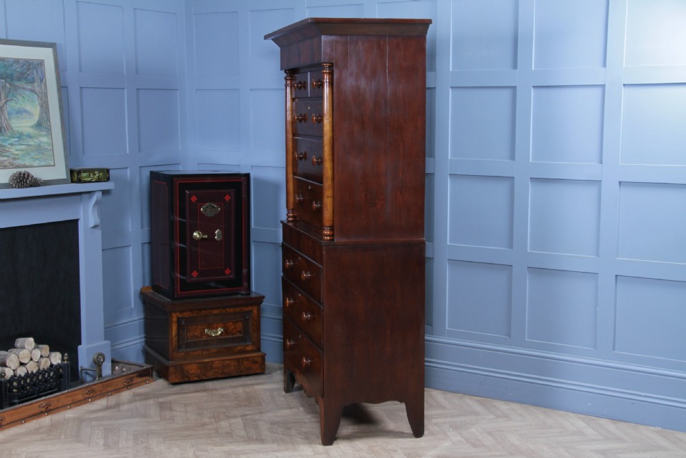 A Georgian Scottish mahogany chest on chest featuring eight drawers with turned wooden knobs, fluted side columns, and an overhanging pediment cornice. View XV
