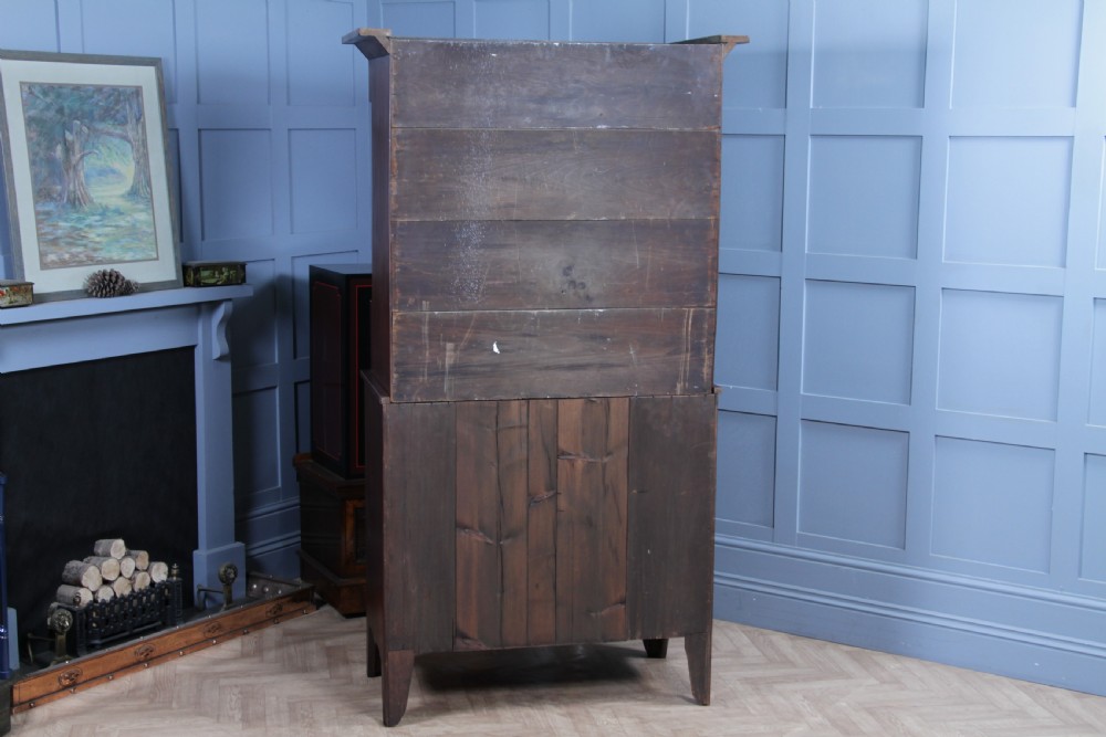 A Georgian Scottish mahogany chest on chest featuring eight drawers with turned wooden knobs, fluted side columns, and an overhanging pediment cornice. View XVI