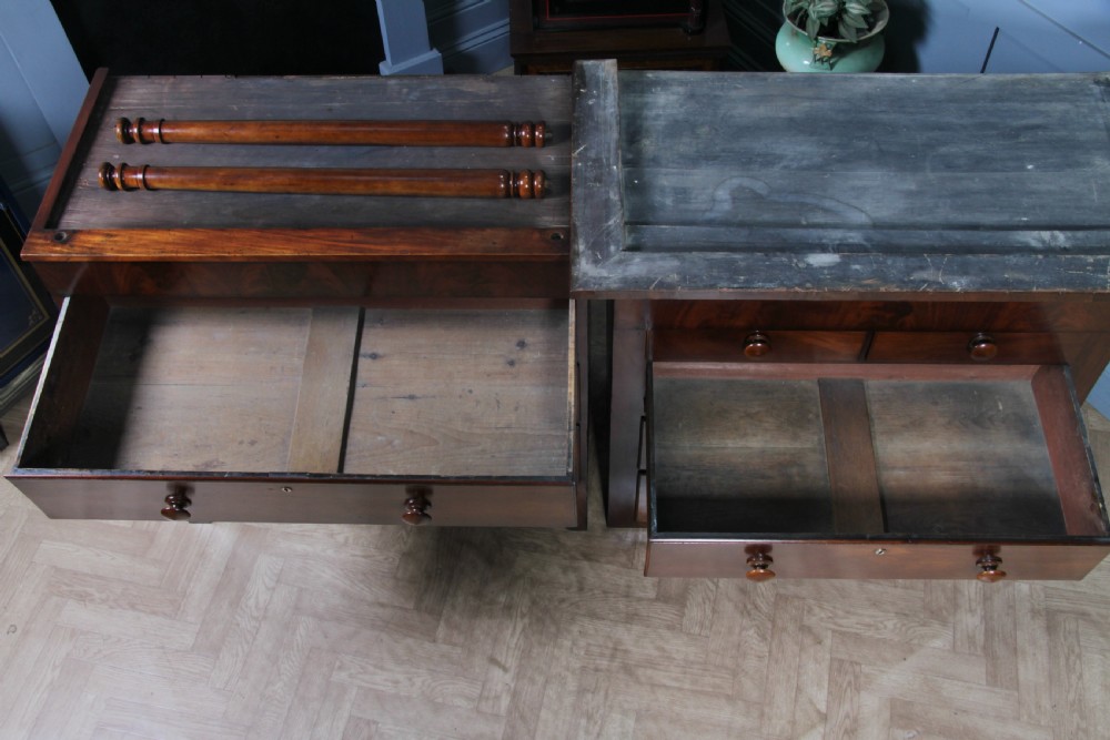 A Georgian Scottish mahogany chest on chest featuring eight drawers with turned wooden knobs, fluted side columns, and an overhanging pediment cornice. View XX
