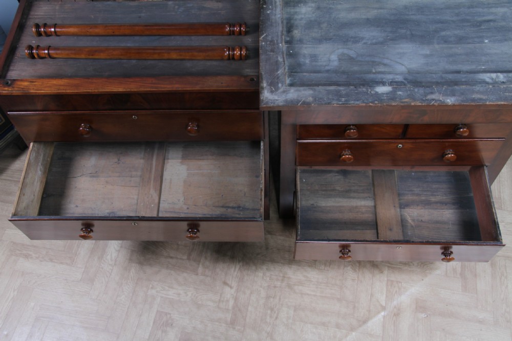 A Georgian Scottish mahogany chest on chest featuring eight drawers with turned wooden knobs, fluted side columns, and an overhanging pediment cornice. View XXI