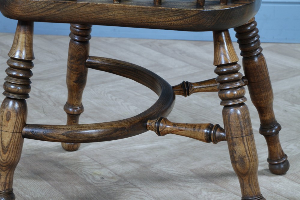 A traditional high-back Windsor armchair crafted from ash and elm wood, featuring a pierced central splat, spindled backrest, turned legs, and a cow horn stretcher. View VI
