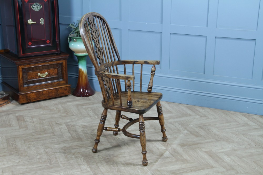 A traditional high-back Windsor armchair crafted from ash and elm wood, featuring a pierced central splat, spindled backrest, turned legs, and a cow horn stretcher. View VIII