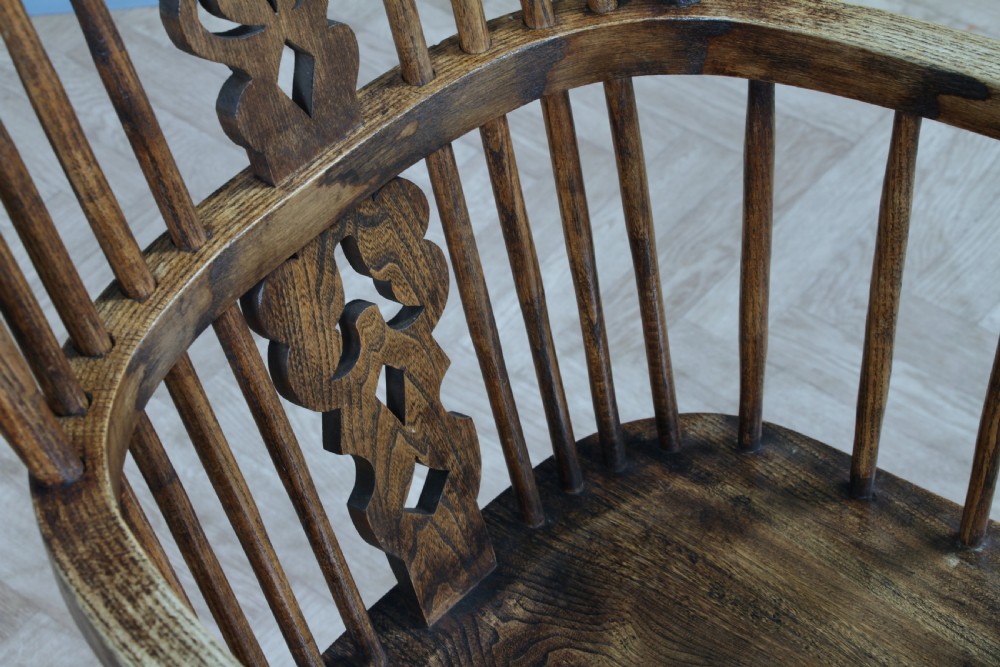 A traditional high-back Windsor armchair crafted from ash and elm wood, featuring a pierced central splat, spindled backrest, turned legs, and a cow horn stretcher. View XIII