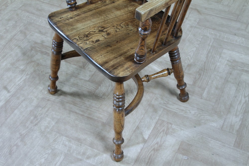 A traditional high-back Windsor armchair crafted from ash and elm wood, featuring a pierced central splat, spindled backrest, turned legs, and a cow horn stretcher. View XIV