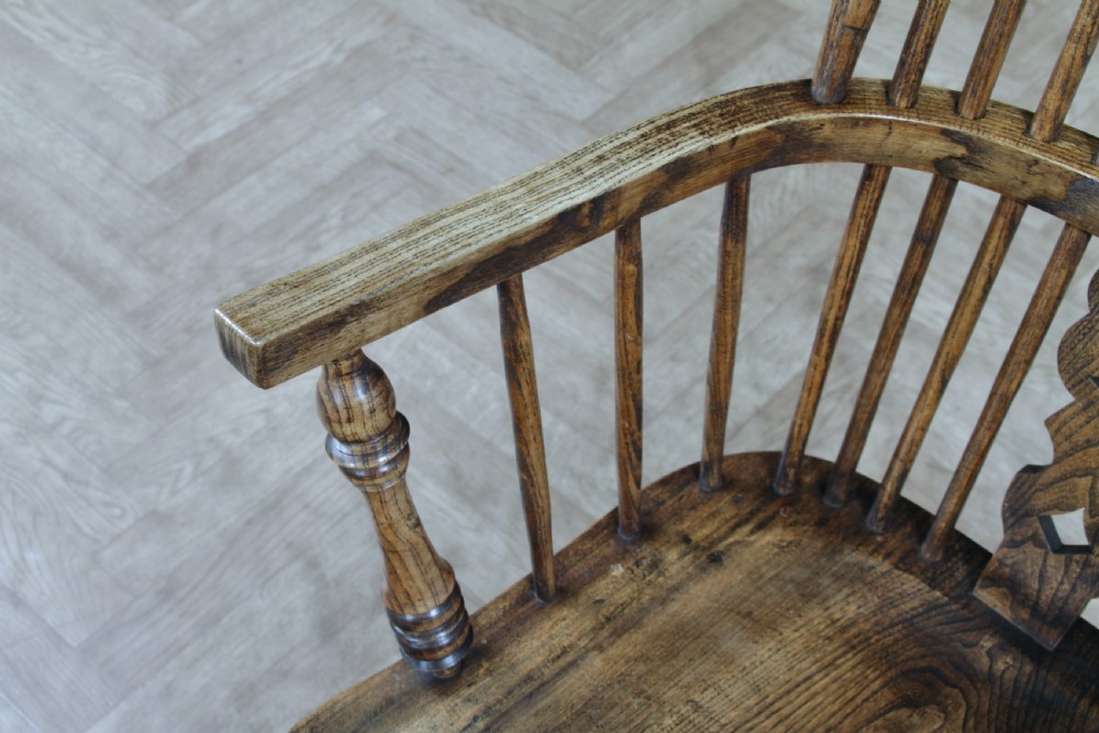 A traditional high-back Windsor armchair crafted from ash and elm wood, featuring a pierced central splat, spindled backrest, turned legs, and a cow horn stretcher. View XV