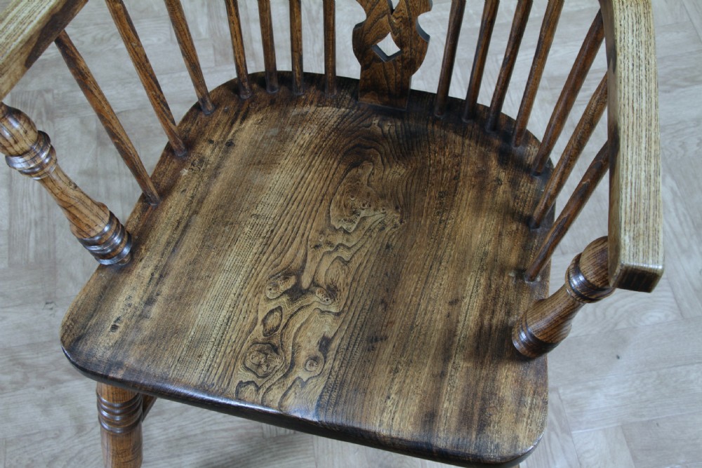 A traditional high-back Windsor armchair crafted from ash and elm wood, featuring a pierced central splat, spindled backrest, turned legs, and a cow horn stretcher. View XVI