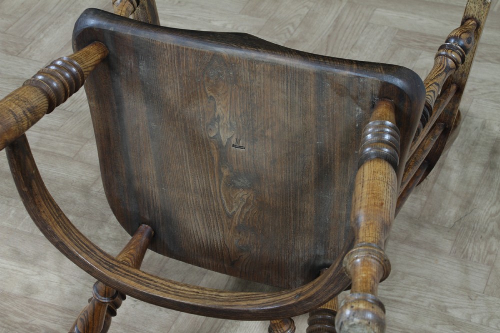 A traditional high-back Windsor armchair crafted from ash and elm wood, featuring a pierced central splat, spindled backrest, turned legs, and a cow horn stretcher. View XX