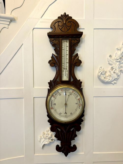ANTIQUE CARVED OAK ANEROID BAROMETER WITH THERMOMETER