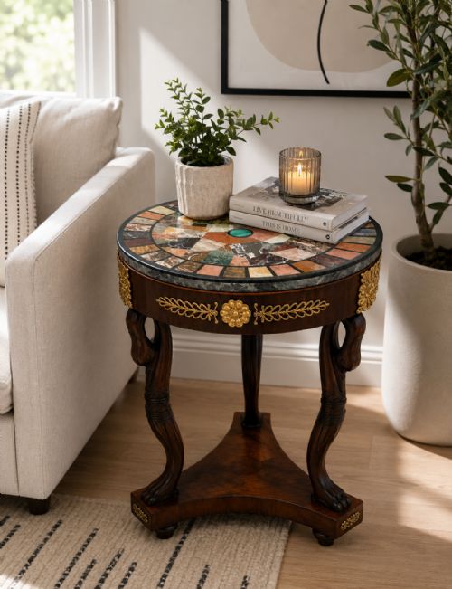 fig 1. A circular antique side table with a specimen marble top, mahogany apron with brass mounts, and carved swan supports on a triform base.