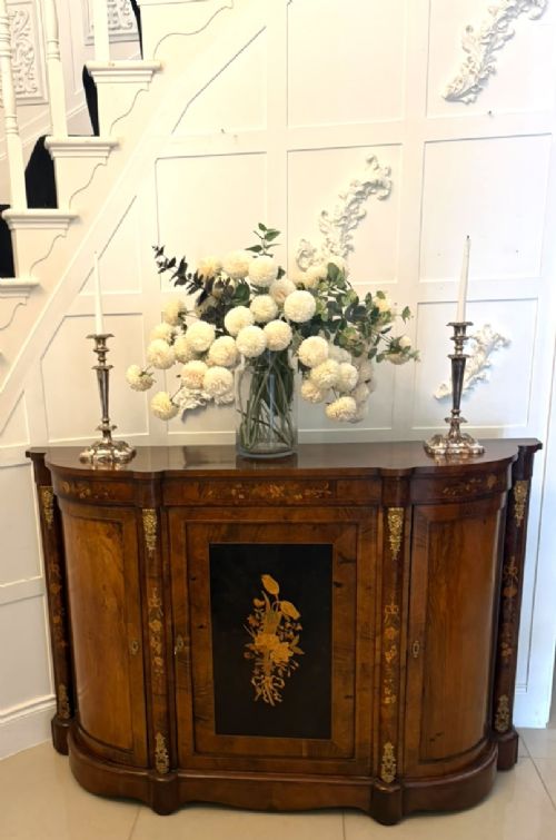 A nineteenth-century Victorian burr walnut credenza featuring curved side doors, intricate floral marquetry inlays, and gilt bronze mounts. View VIII