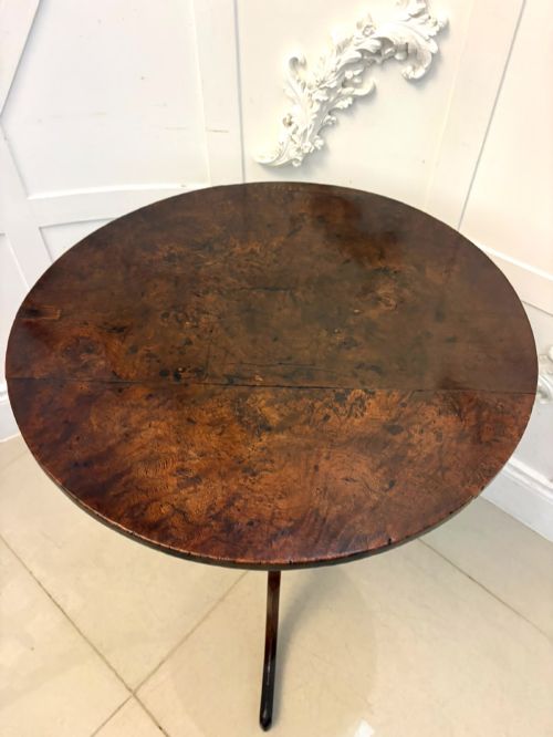fig 3. An 18th-century Georgian burr oak tilt-top occasional table featuring a circular surface, turned pedestal column, and tripod base shown upright.