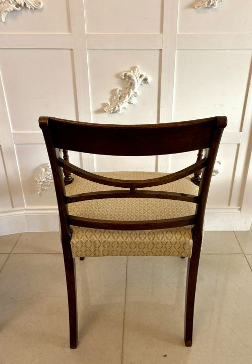 fig 2. A set of eight George III style mahogany dining chairs featuring two carvers and six side chairs with reeded frames and patterned cream upholstered seats.