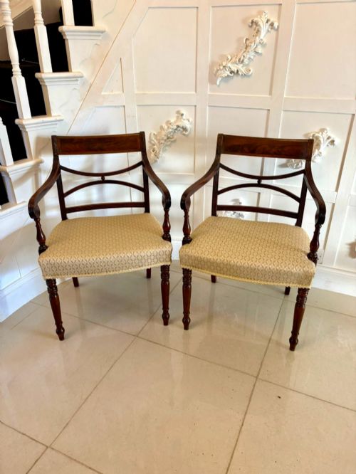 fig 3. A set of eight George III style mahogany dining chairs featuring two carvers and six side chairs with reeded frames and patterned cream upholstered seats.