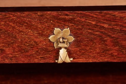 fig 4. A Victorian burr walnut bureau writing desk featuring a fall-front flap, internal drawers, brass handles, and carved cabriole legs ending in paw feet.