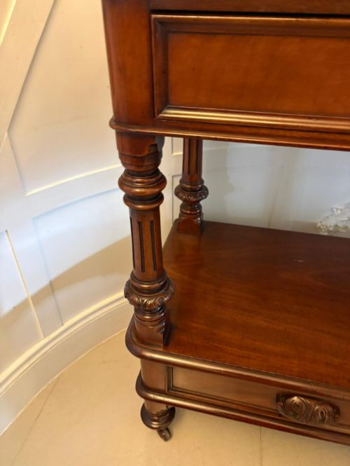 fig 2. A Victorian mahogany buffet server featuring an openwork carved gallery back, four drawer compartments, turned columns, and an open lower shelf.