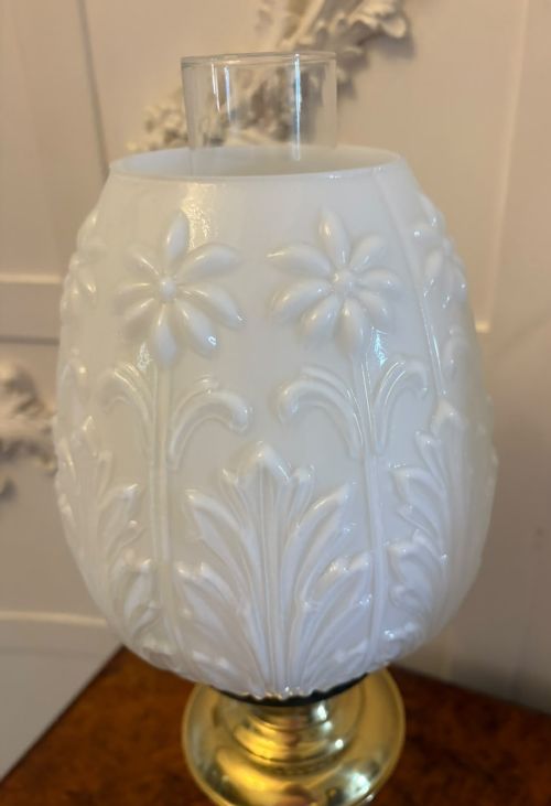 fig 3. A near pair of Edwardian brass oil lamps featuring moulded white opaline glass shades and clear glass chimneys.