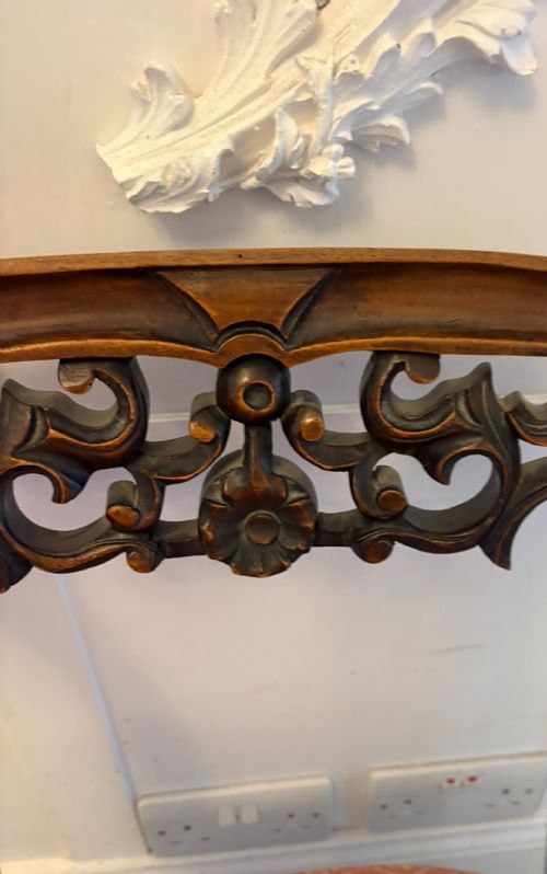 A pair of Victorian carved walnut side chairs with openwork backs and terracotta patterned fabric seats. View XI