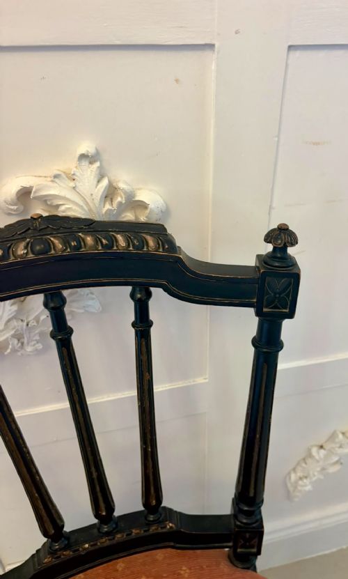 A set of four antique Victorian side chairs featuring ebonised black frames with turned spindle backrests, gilt details, turned front legs, and terracotta patterned upholstered seats. View XI