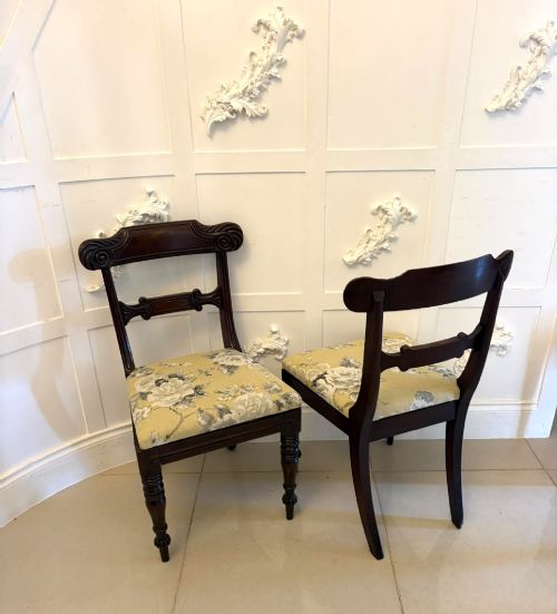 fig 3. A set of eight Regency mahogany dining chairs comprising six side chairs and two carver armchairs with scroll-carved top rails and turned front legs.