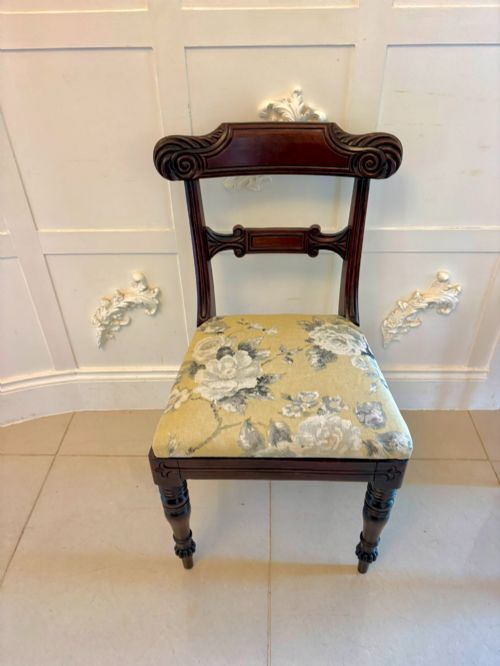 fig 4. A set of eight Regency mahogany dining chairs comprising six side chairs and two carver armchairs with scroll-carved top rails and turned front legs.
