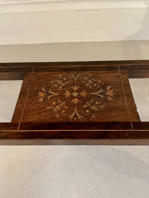fig 1. An antique Victorian dark rosewood writing desk featuring decorative floral marquetry inlays, turned legs, and an upper superstructure with twin glazed cabinets and an arched mirror.