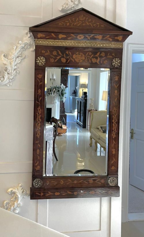 A tall mahogany wall mirror featuring a pediment top and detailed floral marquetry inlay across the entire timber frame. View VII