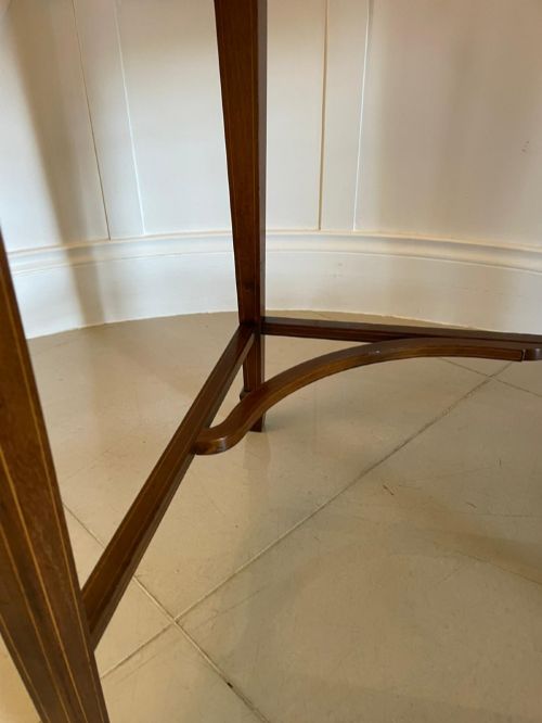 fig 1. An Edwardian mahogany cylinder writing desk featuring satinwood inlay, brass gallery top rail, and tapered square legs.