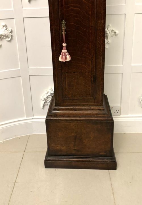 A George III oak and burr oak longcase clock featuring a square brass dial, fretwork hood frieze, and a long waist door. View IX