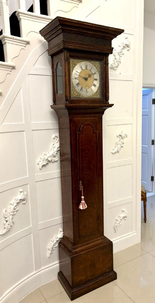 A George III oak and burr oak longcase clock featuring a square brass dial, fretwork hood frieze, and a long waist door. View XI