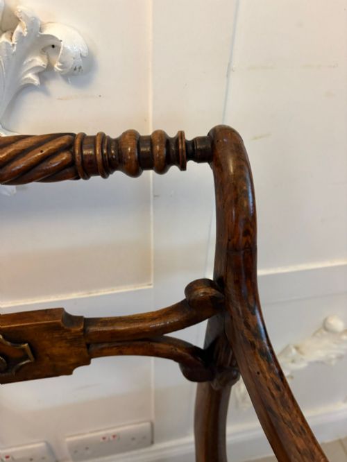 fig 2. A set of six dark mahogany Regency dining chairs featuring rope-twist top rails, curved sabre legs, and woven cane seats.
