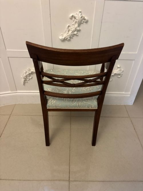 fig 3. A set of ten Edwardian mahogany dining chairs, including two carver armchairs, featuring lattice backrests and pale blue patterned fabric upholstery.