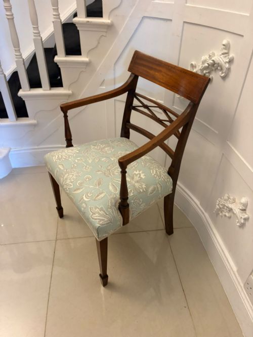 fig 5. A set of ten Edwardian mahogany dining chairs, including two carver armchairs, featuring lattice backrests and pale blue patterned fabric upholstery.