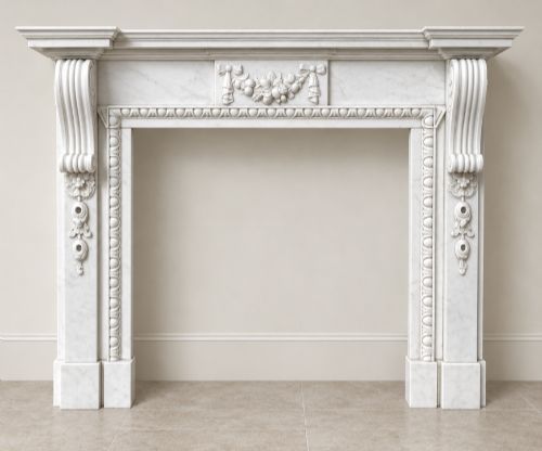 fig 1. A pair of carved white marble Edwardian fireplace surrounds featuring fruit swags, ribbon bow motifs, and scrolled side brackets.