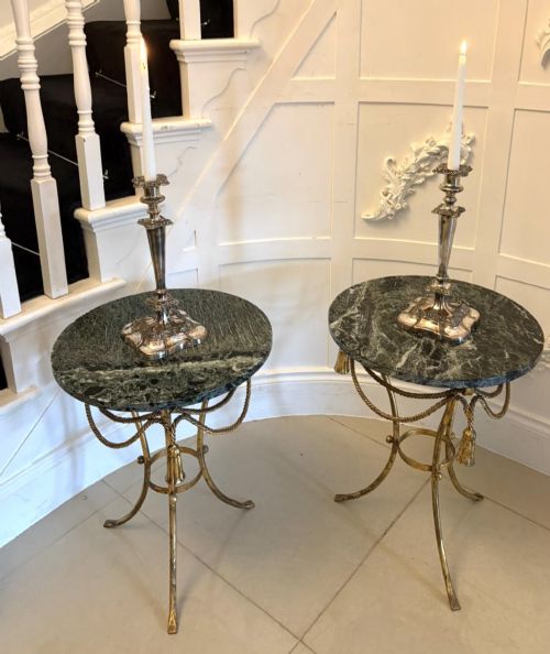 fig 4. A pair of circular Italian side tables featuring dark green marble tops supported by gilt metal legs adorned with draped rope and tassel motifs.