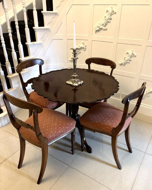 fig 3. A mahogany George III style tilt-top centre table featuring a scalloped piecrust edge, central pedestal, and tripod cabriole legs with claw and ball feet.