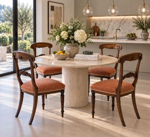 fig 1. A set of four antique Regency rosewood dining chairs featuring carved scroll top rails and pattern-upholstered seats on turned front legs.