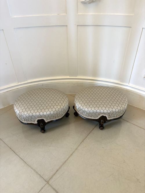 fig 2. An eleven-piece antique Victorian carved walnut salon suite featuring a central sofa, pair of armchairs, six side chairs, and two footstools, all upholstered in a patterned cream fabric.