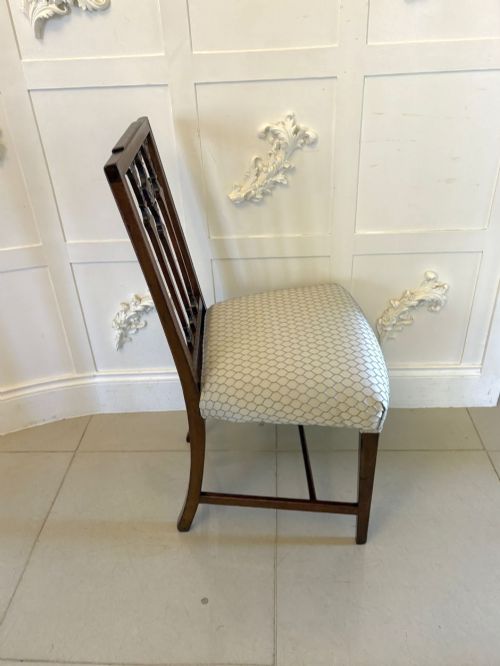 fig 4. A set of eight dark mahogany Victorian dining chairs with carved backs and light geometric patterned upholstered seats, including two carvers with armrests.
