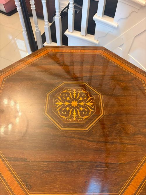 fig 2. An octagonal Victorian rosewood centre table with intricate central marquetry inlay, crossbanded borders, and spiral turned legs joined by a lower stretcher.