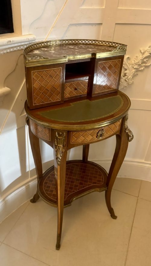 A French kingwood parquetry bonheur du jour writing desk featuring a green leather inset, marble top gallery, and gilt-bronze mounts on slender cabriole legs. View XIII