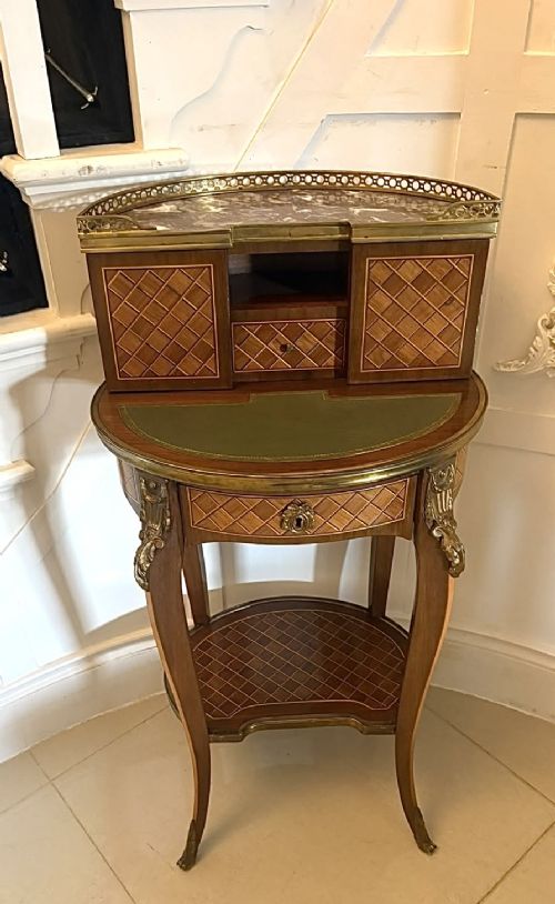 A French kingwood parquetry bonheur du jour writing desk featuring a green leather inset, marble top gallery, and gilt-bronze mounts on slender cabriole legs. View XV