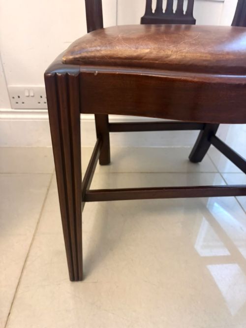 fig 2. A set of eight Victorian mahogany Hepplewhite style dining chairs with carved shield backs and tan leather seats.
