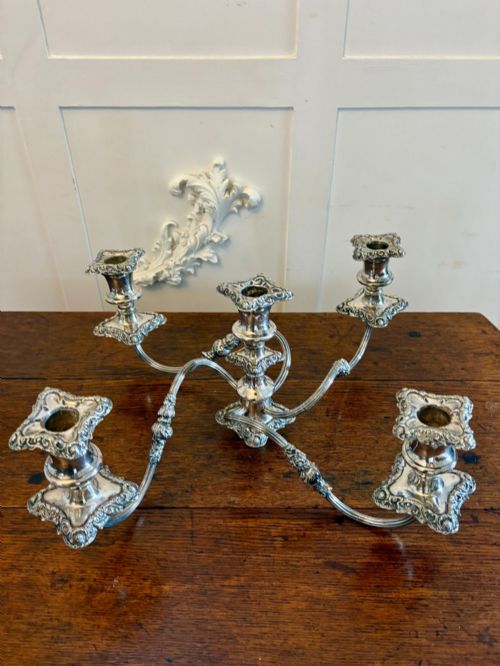 fig 1. A Victorian silver-plated five-branch candelabra featuring scroll arms, ornate foliate moulding, and a shaped pedestal base.