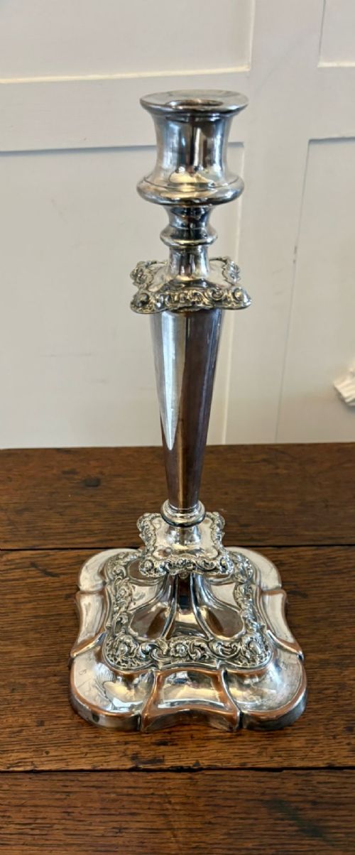 fig 2. A Victorian silver-plated five-branch candelabra featuring scroll arms, ornate foliate moulding, and a shaped pedestal base.
