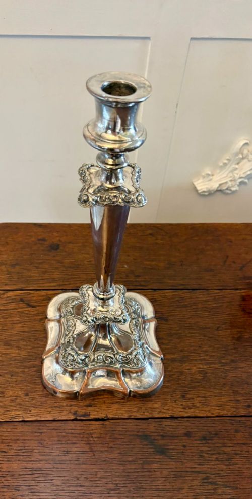 fig 3. A Victorian silver-plated five-branch candelabra featuring scroll arms, ornate foliate moulding, and a shaped pedestal base.