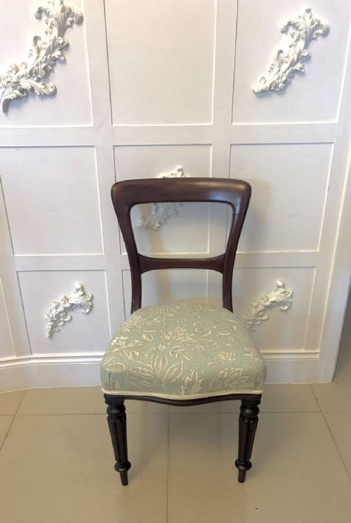 Set of six Victorian mahogany dining chairs featuring curved open backrests, reeded front legs, and light blue pattern-upholstered seats. View IX