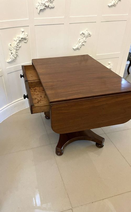 A Regency mahogany sofa table featuring two short drawers with black turned knobs, twin drop-leaf flaps, a central octagonal pedestal, and a quadruped base. View IX