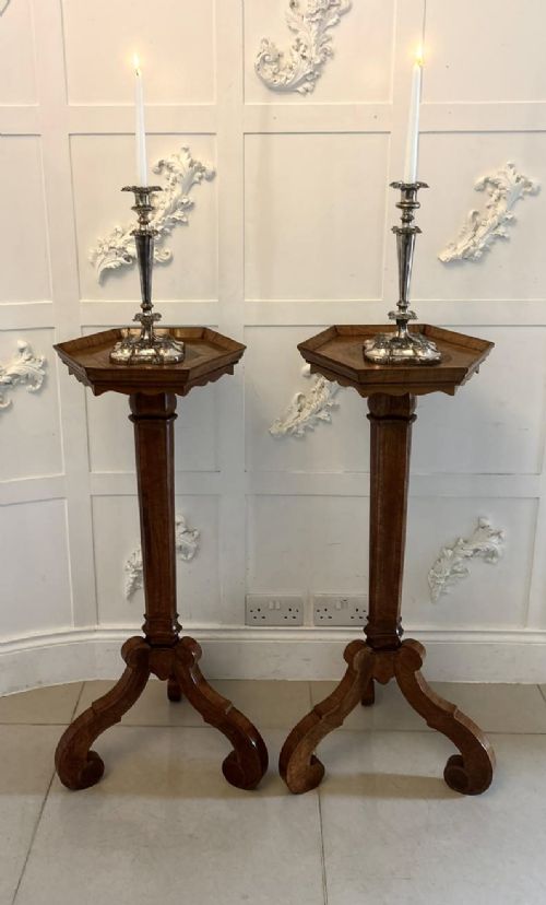 fig 4. A pair of tall antique Dutch walnut and kingwood pedestal torcheres with molded hexagonal tops and scroll tripod feet.