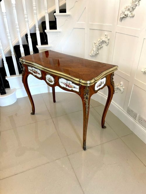 fig 4. A Victorian Louis XV Revival kingwood console card table featuring a serpentine fold-over top, cabriole legs, gilt bronze mounts, and inset painted porcelain plaques.