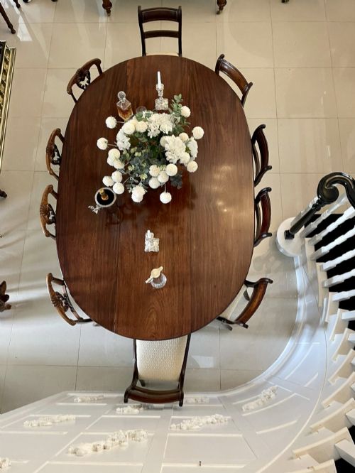 fig 2. A large Georgian mahogany wake table shown with drop leaves folded down, featuring straight square legs and a polished polished timber top.